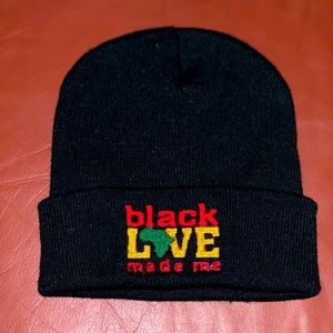 Black love made me unisex embroidered beanie with green embroidered Africa.